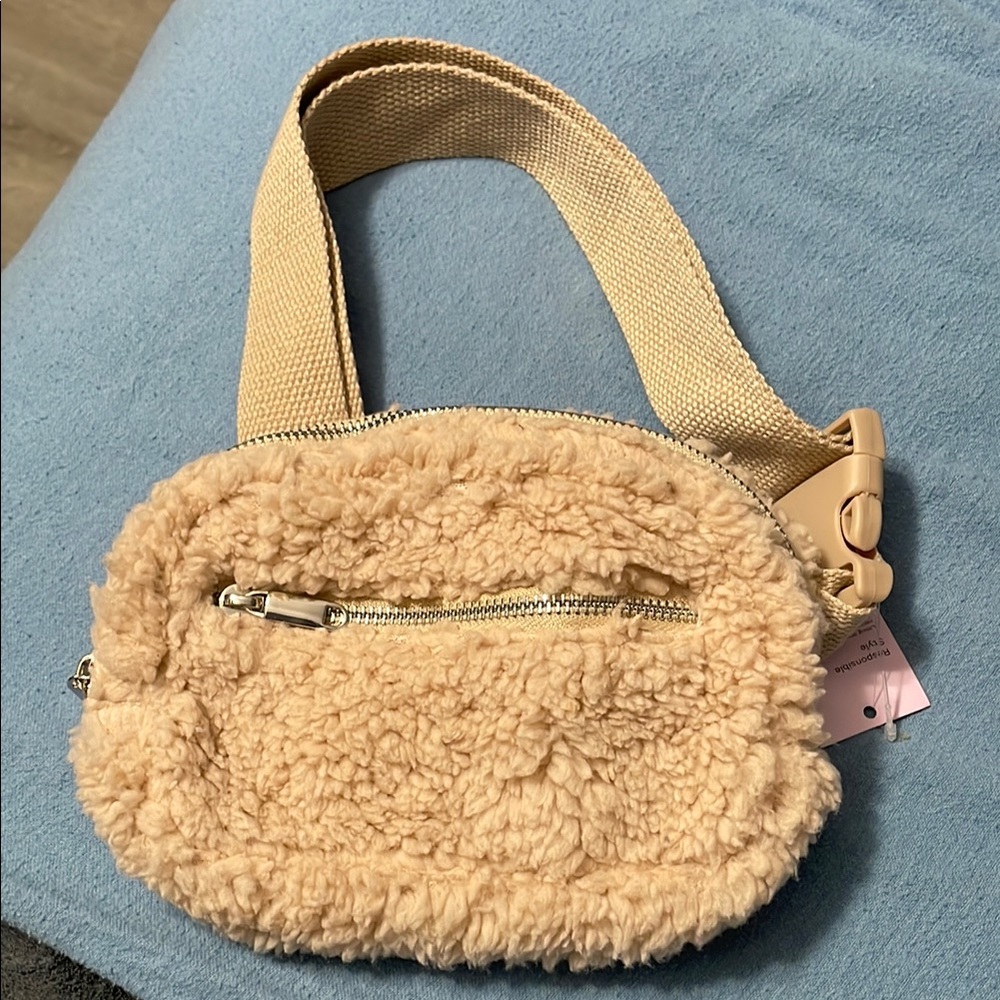 Tan Plush Crossbody Bag with Soft Material and Woven Strap